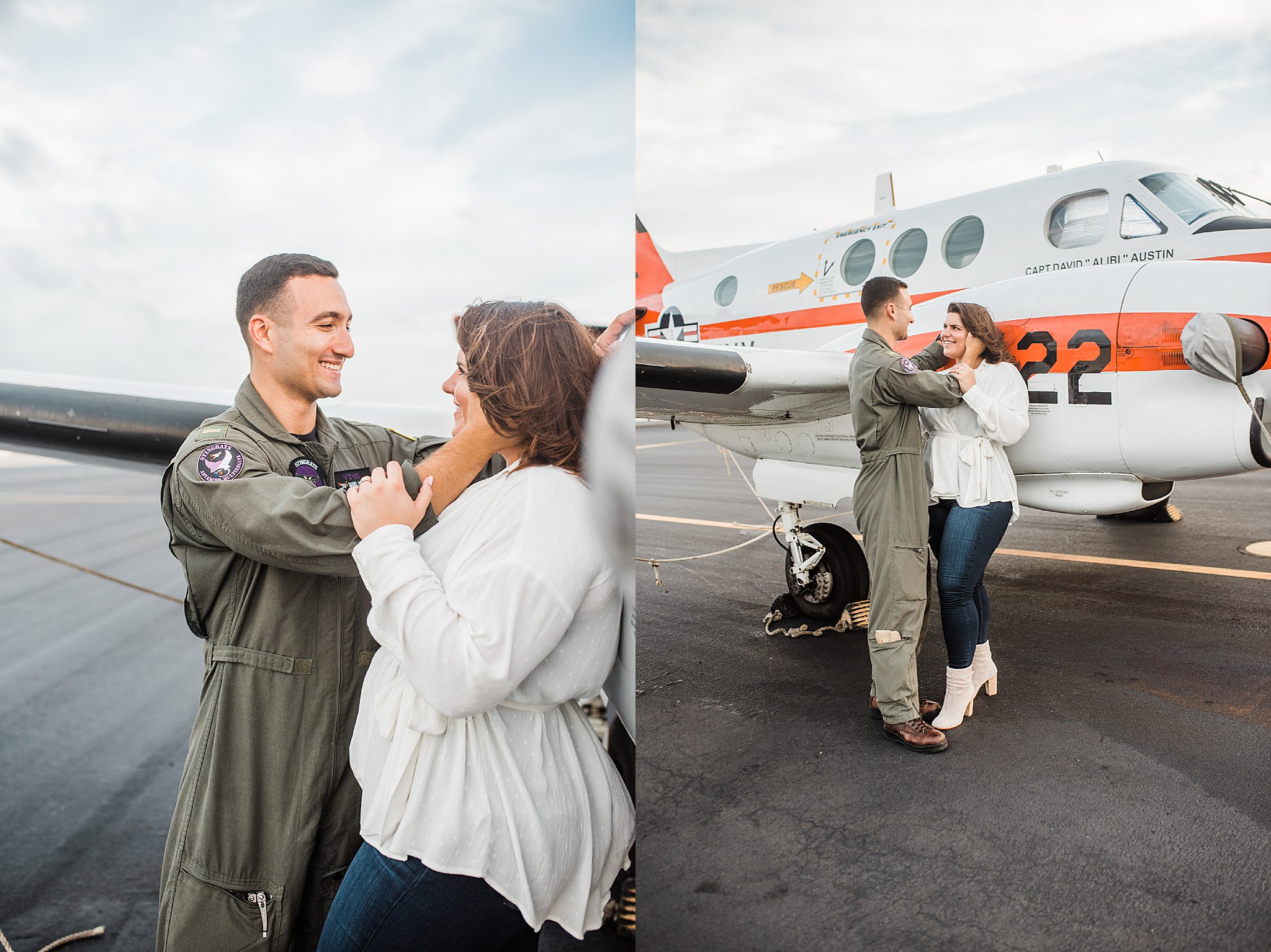 Navy Pilot in Green flight suit on flightline next to white plane with orange stripe with fiance in white top and blue jeans