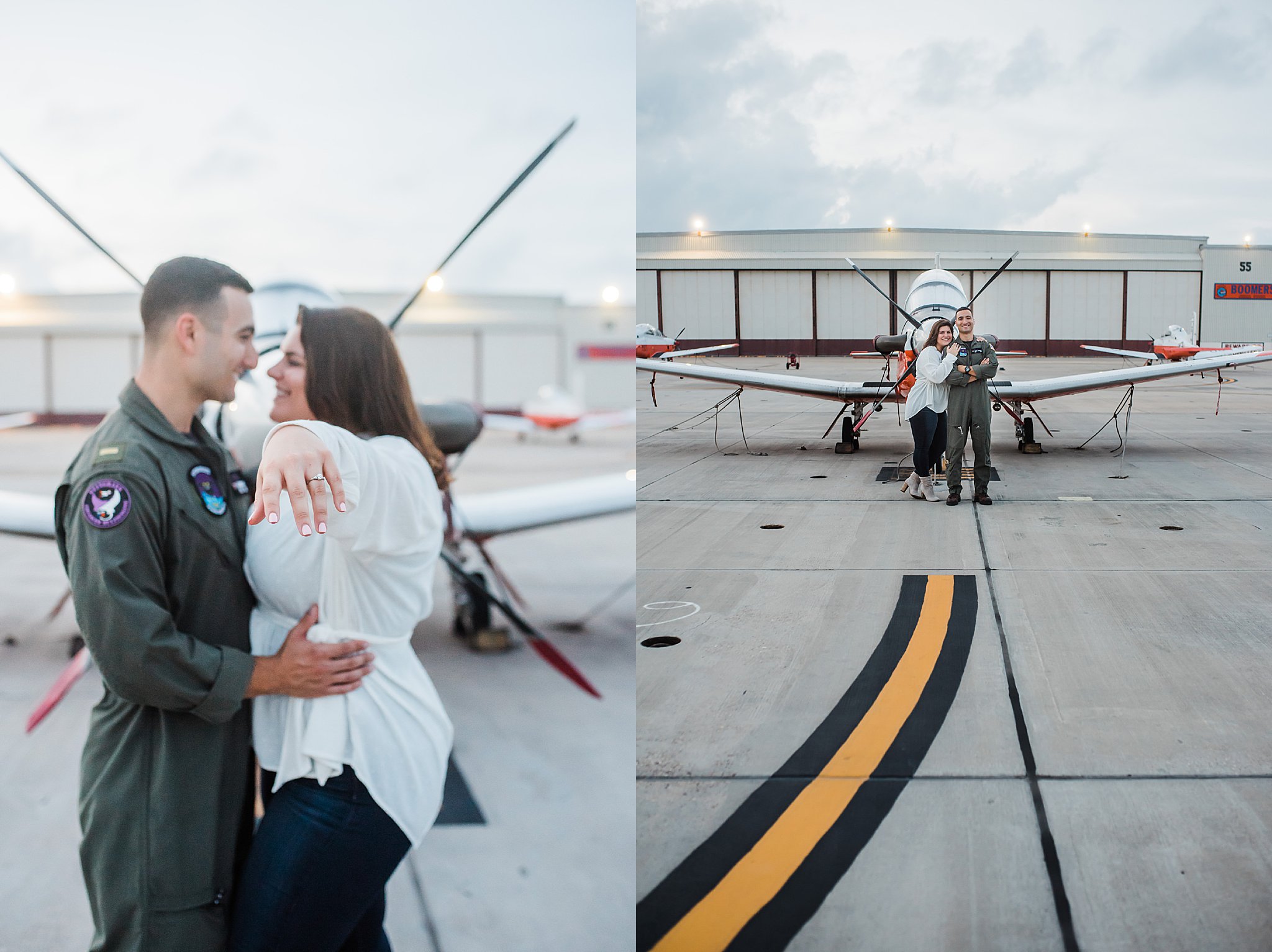 Navy Pilot in Green flight suit on flightline in front of white plane with orange stripe with fiance in white top and blue jeans